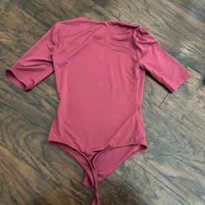 Women’s pink bodysuit